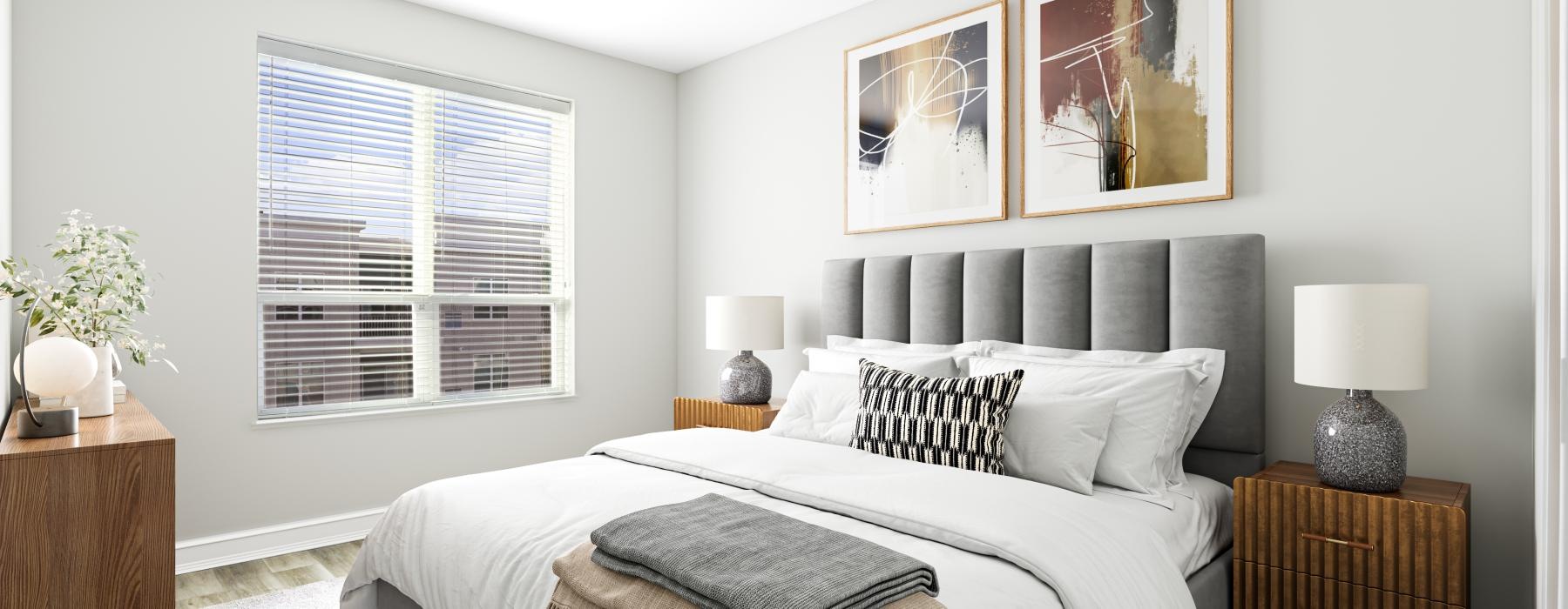 a bedroom with a bed and a lamp