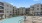 a pool in a courtyard between buildings
