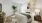 a bedroom with a bed and a plant