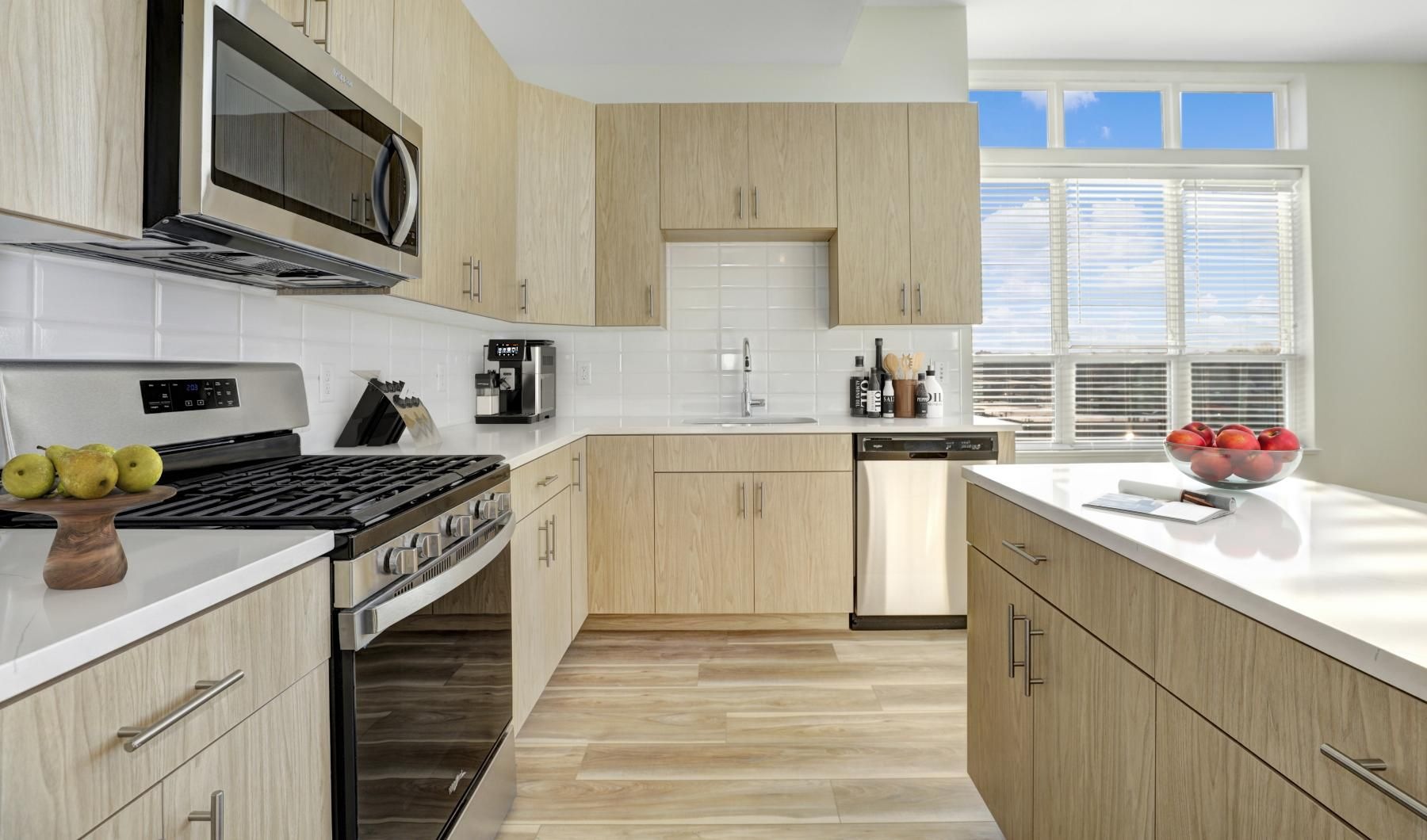a kitchen with wooden cabinets