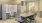 a room with a table and chairs and cubicles